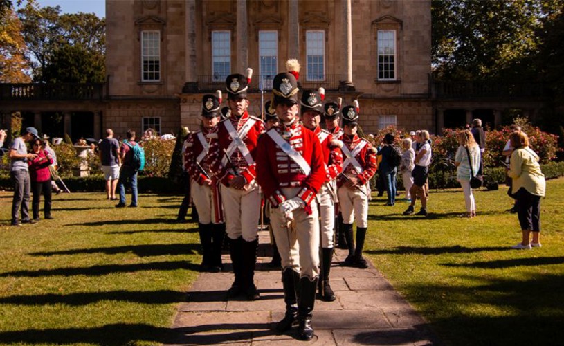 People dressed as soldiers for the Jane Austen Festival Regency Costumed Promenade